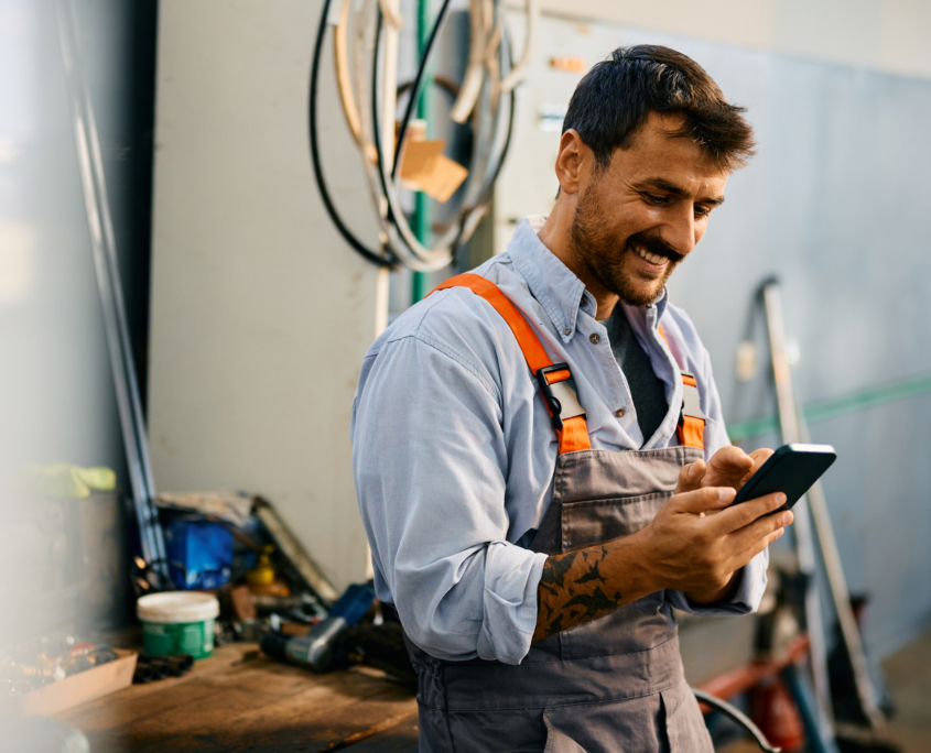 A handsome employer checks stock levels. He offers good useable health benefits to his employees. Blue Collar workers.